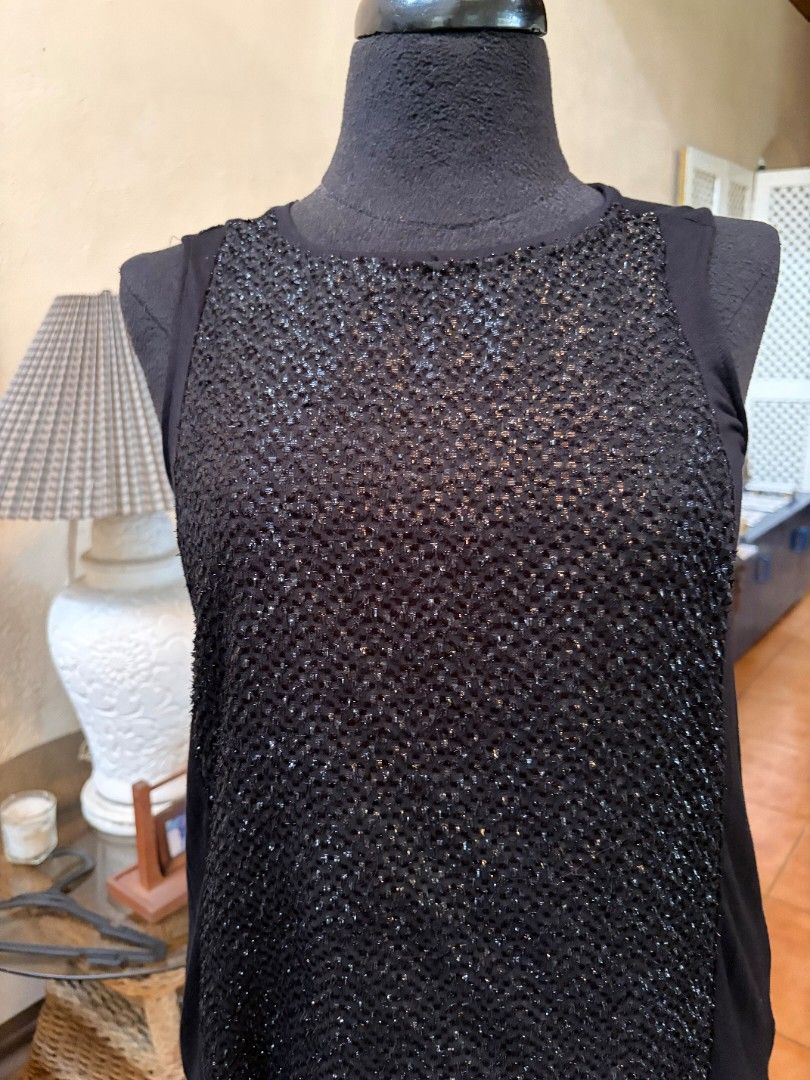 Black Sparkly Mesh Top Sheer Sleeves (Category: Blouses) located in Makati City. Submitted by micmic804 (Listing ID 1451325977, Image 2). Description: - Chic black top with a unique sparkly textured front panel. - Features sheer fabric on the sleeves and sides for a stylish look. - Highly versatile, suitable for both casual and dressy occasions. - Ideal for parties, nights out, or adding a touch of glamour to your outfit. - Bought but never worn.