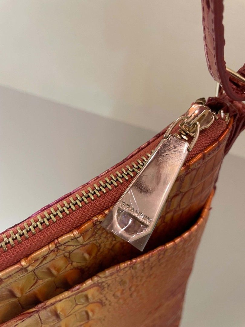 Brahmin Ombre Croc Embossed Leather Shoulder Bag (Category: Luxury Bags & Wallets) located in Plaridel. Submitted by collectors_blocc (Listing ID 1451468094, Image 3). Description: - Beautiful Brahmin shoulder bag - Stunning ombre effect with croc-embossed leather - Colors transition from pink to orange and yellow - Secure zipper closure - Interior pockets for organization - Adjustable strap for comfortable wear - Versatile for everyday use or a 