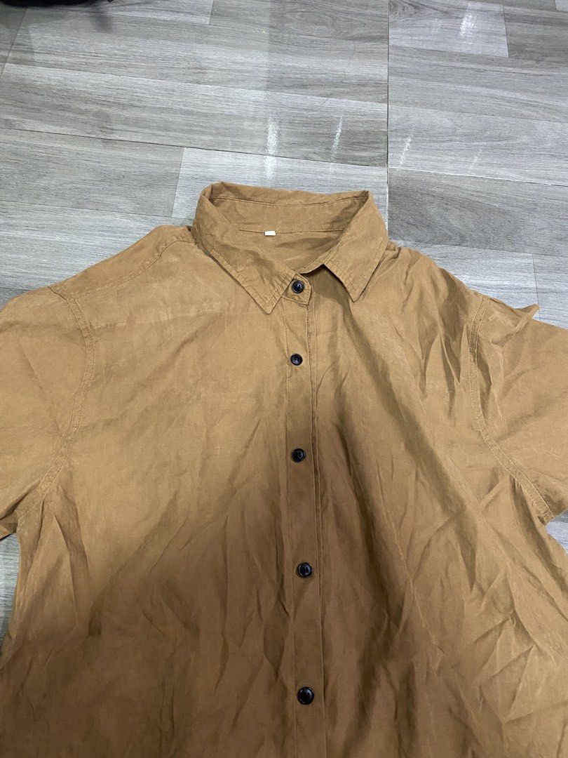 Brown Short Sleeve Polo (Category: Blouses) located in Quezon City. Submitted by wompybat (Listing ID 1451491879, Image 2). Description: No brand XL in tag Used once for beach cover-up RFS: Not my style anymore TAGS: Brown, blouse, polo, short-sleeves .