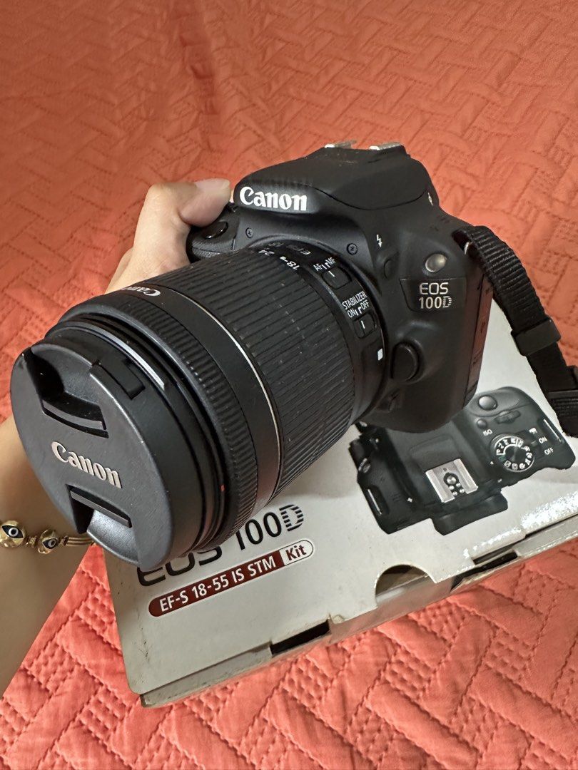 Canon EOS 100D EF-S 18-55 IS STM Kit DSLR Camera (Category: Cameras) located in Manila. Submitted by ericayoo (Listing ID 1451516726, Image 2). Description: - Canon EOS 100D DSLR camera - EF-S 18-55mm IS STM kit lens included - Original box and manuals included - Ideal for beginners and enthusiasts - Easy to handle and operate - Capture your moments with this reliable Canon camera.