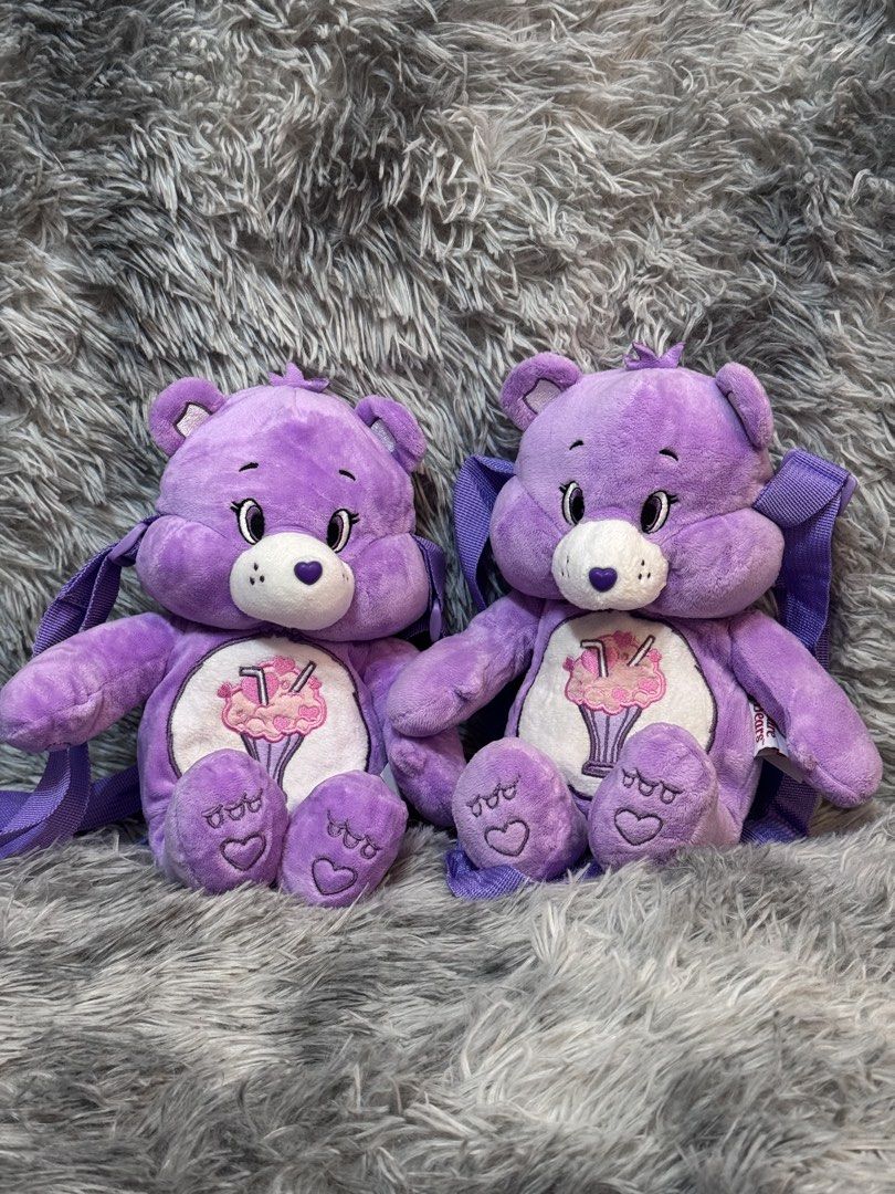 Carebears Plush Sling Bag (Category: Plushies & Soft Toys) located in Antipolo. Submitted by bhabiegraciefashionlab (Listing ID 1451353396, Image 1). Description: Purple Care bears Plush Slibg bags Small compartment Perfect for Carebears fans and collectors From japan 2 pcs avail on hand .