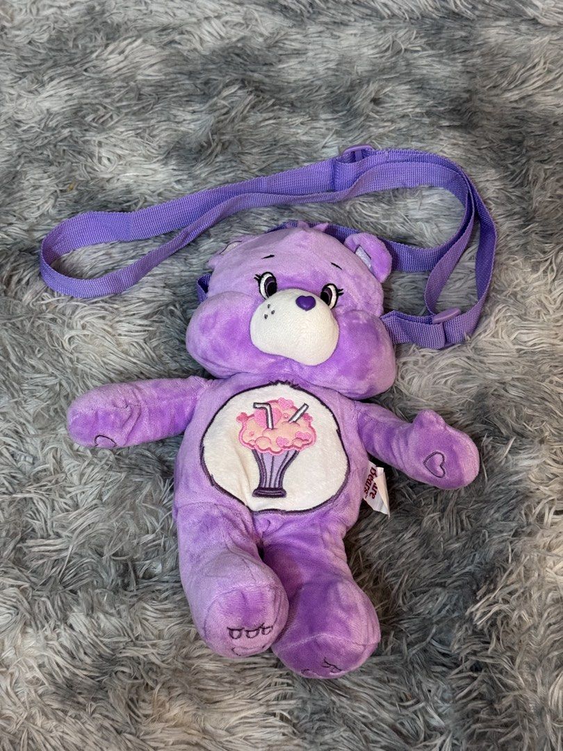 Carebears Plush Sling Bag (Category: Plushies & Soft Toys) located in Antipolo. Submitted by bhabiegraciefashionlab (Listing ID 1451353396, Image 3). Description: Purple Care bears Plush Slibg bags Small compartment Perfect for Carebears fans and collectors From japan 2 pcs avail on hand .