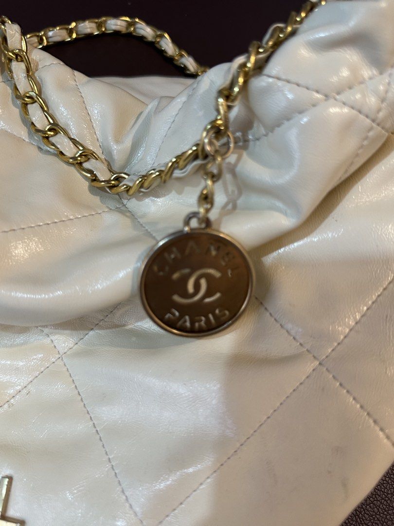 Chanel White Quilted Leather Chain Shoulder Bag (Category: Luxury Bags & Wallets) located in Antipolo. Submitted by royaltree_d25d51 (Listing ID 1451395948, Image 2). Description: - white Chanel shoulder bag - Luxurious quilted leather - Elegant gold chain strap - Features iconic Chanel logo and charm - Spacious interior with zip pocket - "Made in France" label - Stylish gold hardware details - Ideal for everyday use.