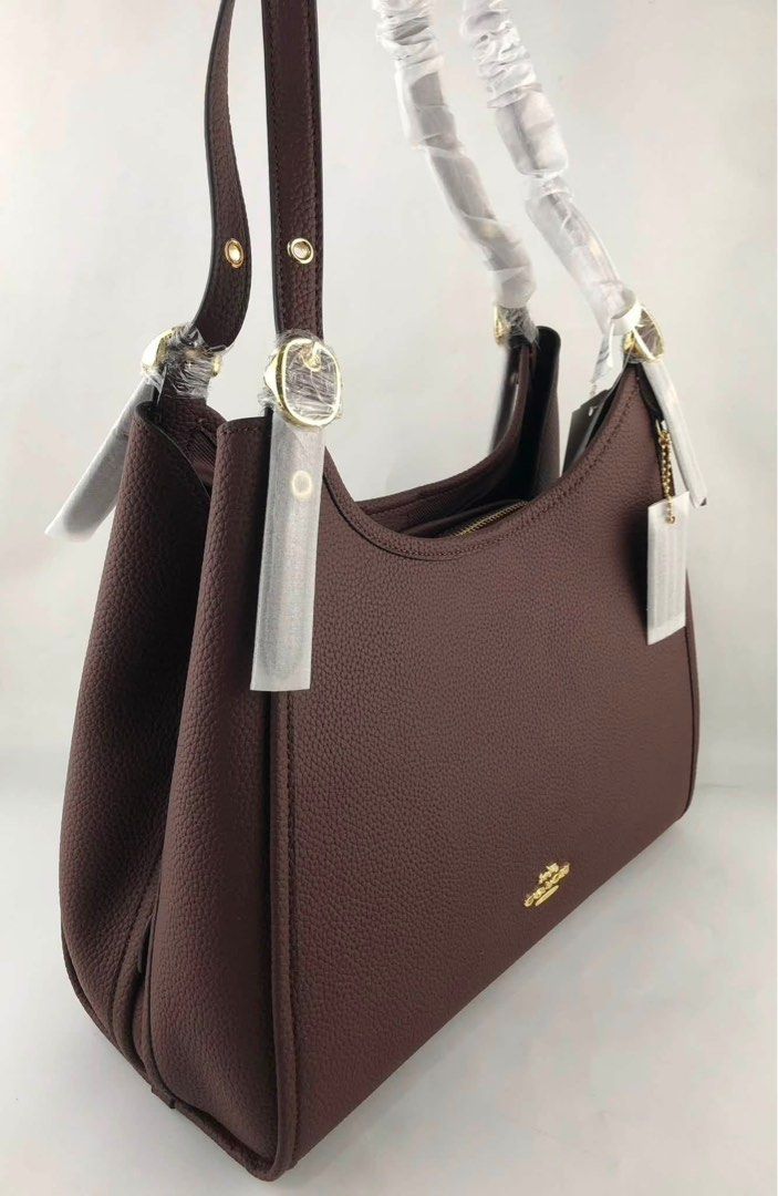 Coach Erin (Category: Shoulder Bags) located in Caloocan City. Submitted by brandeditemsph (Listing ID 1451458726, Image 3). Description: - Brand: Coach - Color: Burgundy - Material: Pebbled Leather - Hardware: Gold-tone - Closure: Zipper on main compartment and back - Interior: Spacious main compartment - Condition: Comes with original tags - Style: Great everyday shoulder bag.