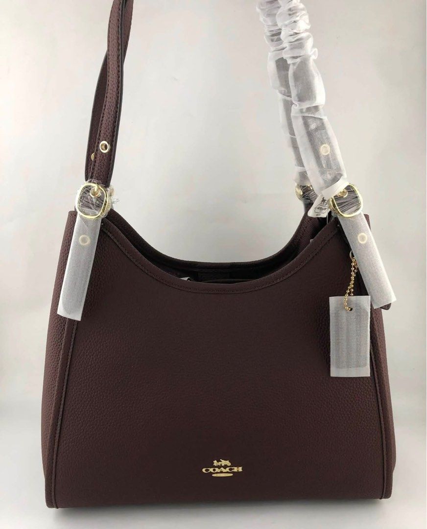 Coach Erin (Category: Shoulder Bags) located in Caloocan City. Submitted by brandeditemsph (Listing ID 1451458726, Image 2). Description: - Brand: Coach - Color: Burgundy - Material: Pebbled Leather - Hardware: Gold-tone - Closure: Zipper on main compartment and back - Interior: Spacious main compartment - Condition: Comes with original tags - Style: Great everyday shoulder bag.