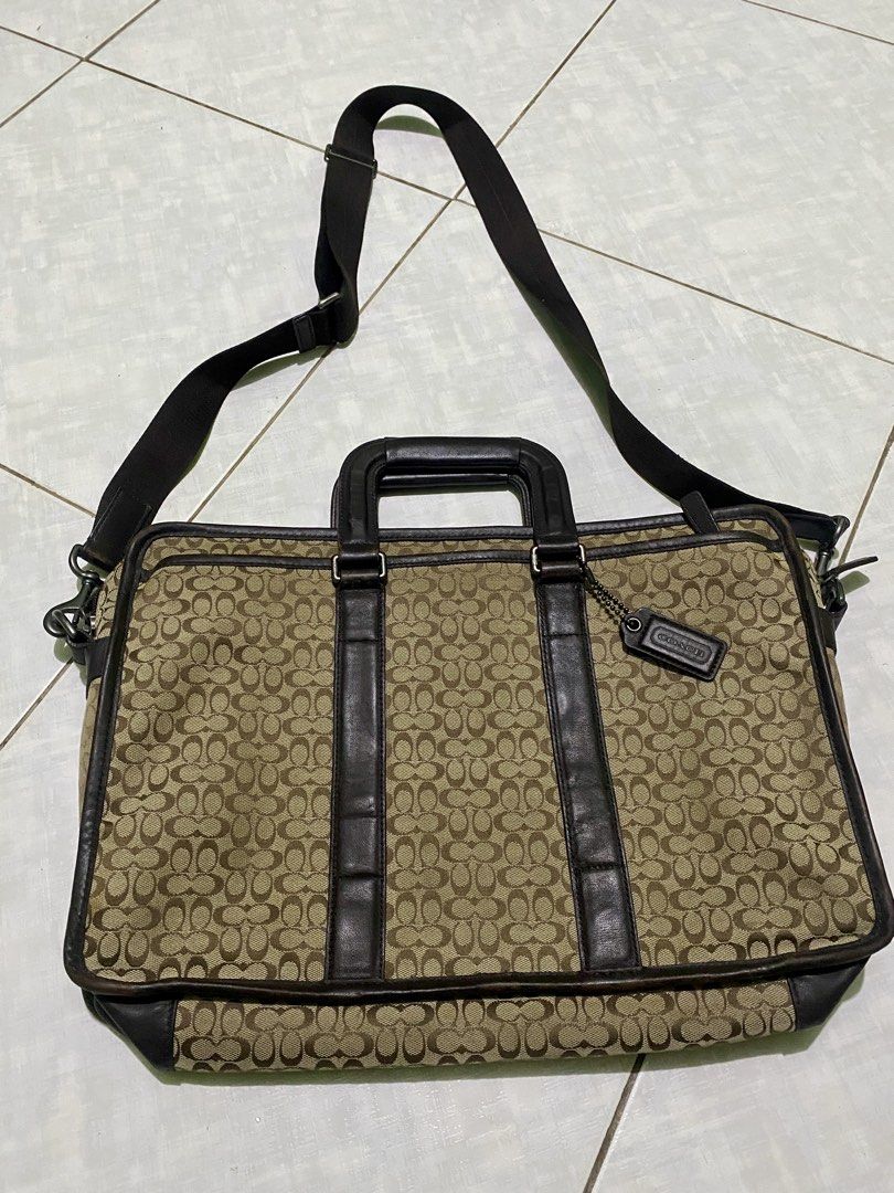 COACH MESSENGER BAG (Category: Briefcases) located in Dagupan City. Submitted by casadebayongph (Listing ID 1451326542, Image 2). Description: - Classic Coach monogram briefcase - Signature tan and brown pattern - Genuine leather trim and handles - Includes detachable shoulder strap - Ample space for work essentials - Ideal for daily use or travel.