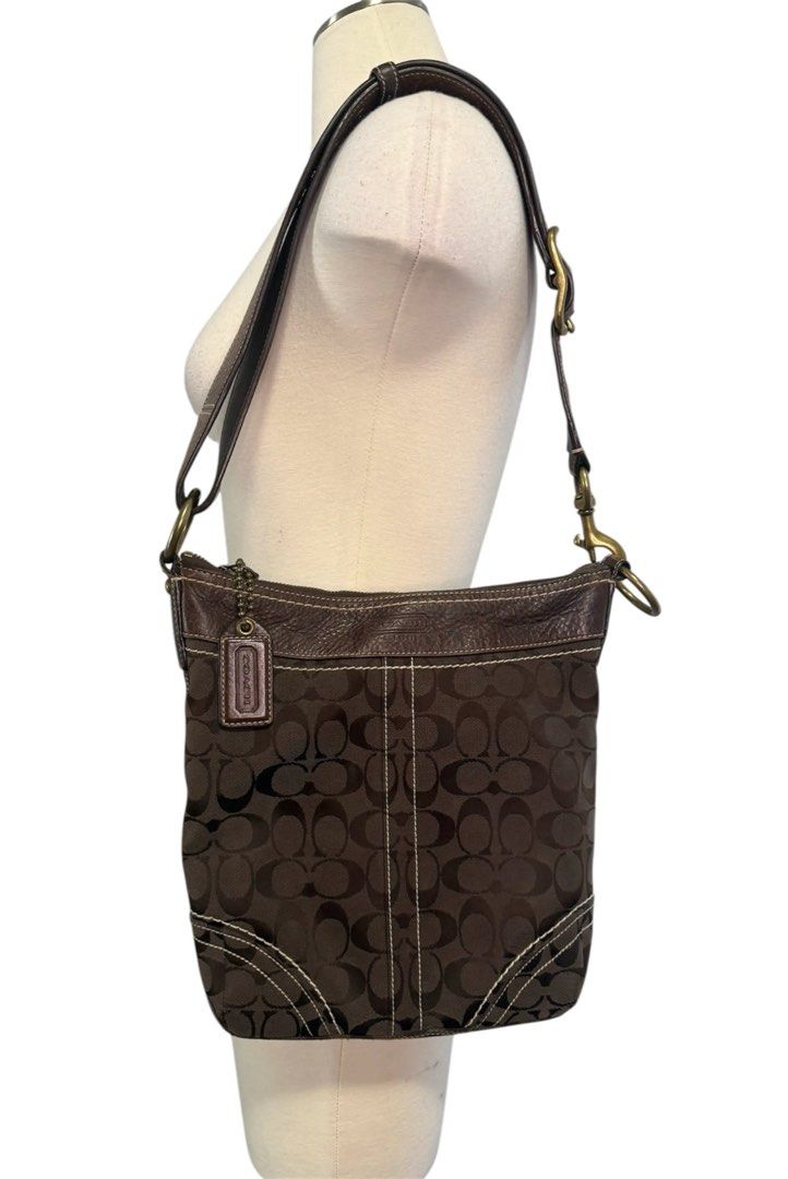 Coach Monogram Canvas Leather Trim Shoulder Bag (Category: Luxury Bags & Wallets) located in Iloilo. Submitted by fromthebins.ilo2 (Listing ID 1451417869, Image 2). Description: - Authentic brown Coach monogram canvas shoulder bag - Genuine leather trim and strap - Convenient zippered front pocket - Interior zippered pocket for essentials - Some signs of wear on leather trim and strap - Overall in good, pre-loved condition -details posted Mop;gca