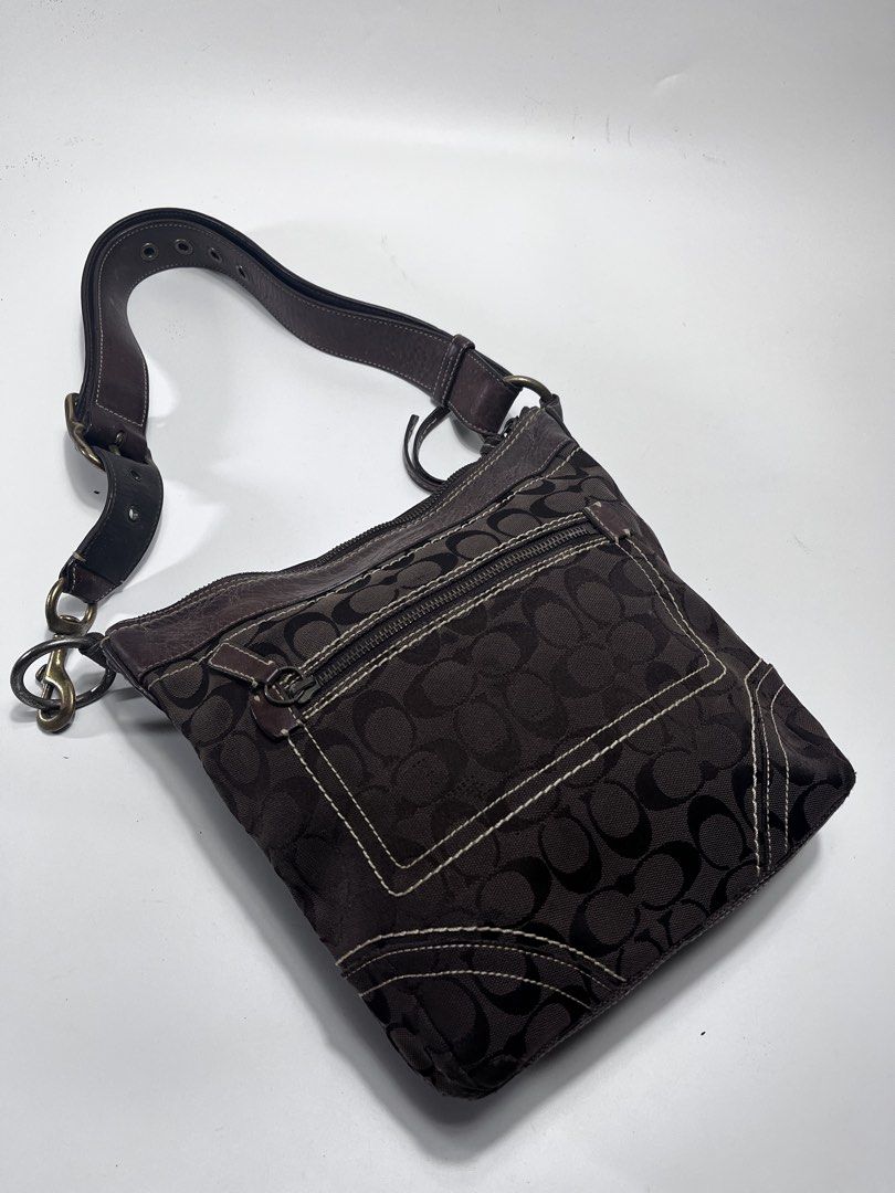 Coach Monogram Canvas Leather Trim Shoulder Bag (Category: Luxury Bags & Wallets) located in Iloilo. Submitted by fromthebins.ilo2 (Listing ID 1451417869, Image 3). Description: - Authentic brown Coach monogram canvas shoulder bag - Genuine leather trim and strap - Convenient zippered front pocket - Interior zippered pocket for essentials - Some signs of wear on leather trim and strap - Overall in good, pre-loved condition -details posted Mop;gca