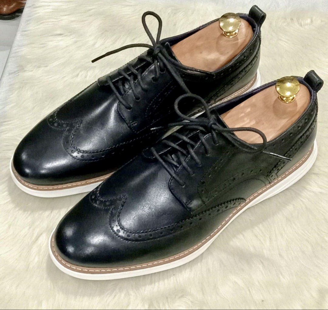 Cole Haan Grand Evolution Wingtip Oxford in Black Leather (Category: Casual Shoes) located in Paranaque City. Submitted by sole2squeeze (Listing ID 1451366162, Image 1). Description: - Classic black leather wingtip oxfords - Comfortable and grippy white rubber sole - Excludes wooden shoe trees - Versatile for smart casual and formal occasions - Well-maintained condition - Size 11W.