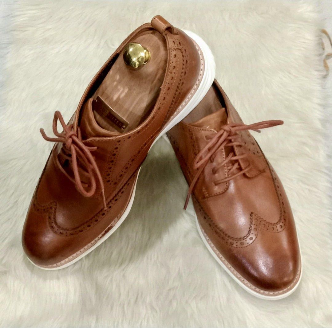 Cole Haan Grand Evolution Wingtip Oxford in British Tan (Category: Casual Shoes) located in Paranaque City. Submitted by sole2squeeze (Listing ID 1451514510, Image 2). Description: - Genuine brown leather wingtip brogues - Classic lace-up style - Contrasting white sole for a modern touch - Excludes wooden shoe trees - Versatile: Ideal for smart casual and formal events - Designed for comfort and style - Size 11W.