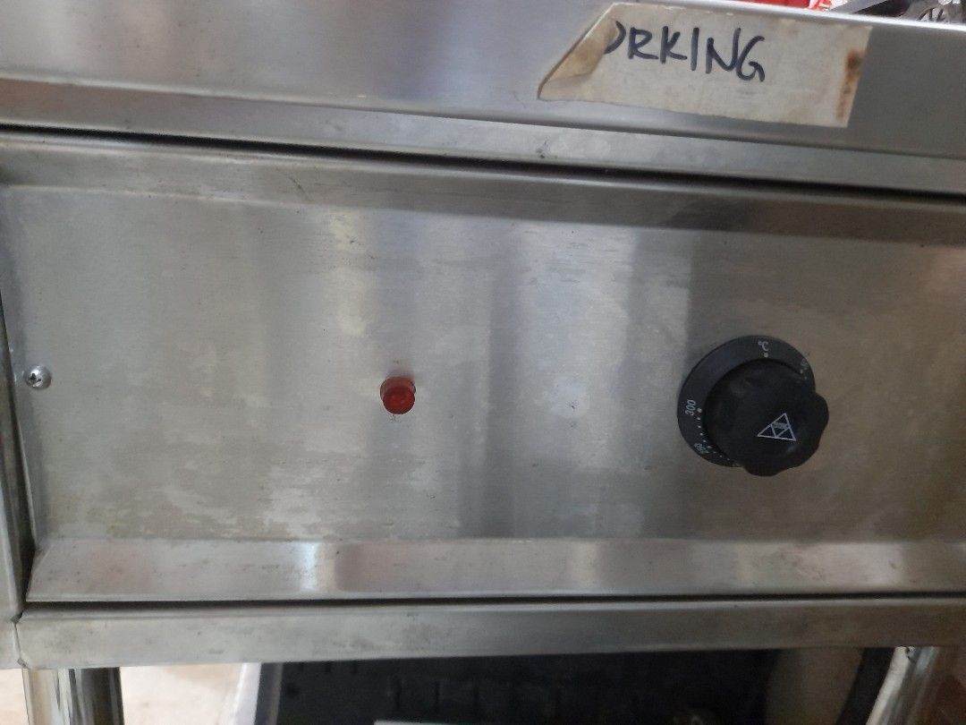Commercial Stainless Steel Double warmer (Category: Other Kitchen Appliances) located in Valenzuela. Submitted by newbear.425b6e (Listing ID 1451376744, Image 3). Description: - Commercial stainless steel griddle - Two round warmer electric - Temperature control knob with indicator light - Mounted on a sturdy stand with lower shelf - Ideal for food business operations.