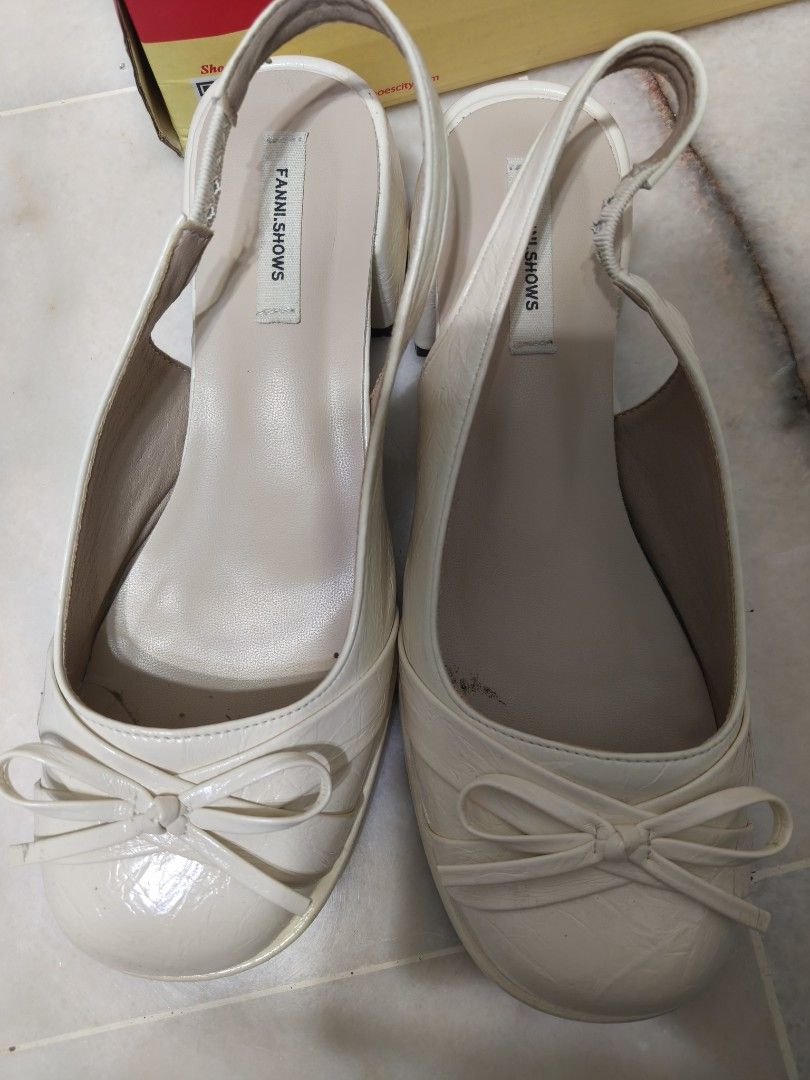 Covered Slingback bow Heels Cream color Size 25.0/40 (Category: Heels) located in Petaling Jaya. Submitted by happieedayy (Listing ID 1451425607, Image 1). Description: - Cream slingback heels from FANILSHOWS - Adorable bow detail on the front - Elastic strap at the back for a secure and comfortable fit - Size: 25.0 /40 - Versatile for casual outings or semi-formal events -reason for selling: size too big for me.