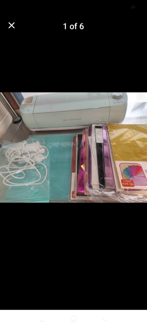Cricut Explore Air 2 Cutting Machine with Accessories (Category: Craft Supplies & Tools) located in Makati City. Submitted by jhuvskie (Listing ID 1451371994, Image 2). Description: - Cricut Explore Air 2 machine - Includes various accessories: vinyl sheets, transfer tape, crafting tools - Ideal for DIY projects, custom decals, personalized gifts, and more - Machine is in good working order - Bundle includes all items shown in the photos.
