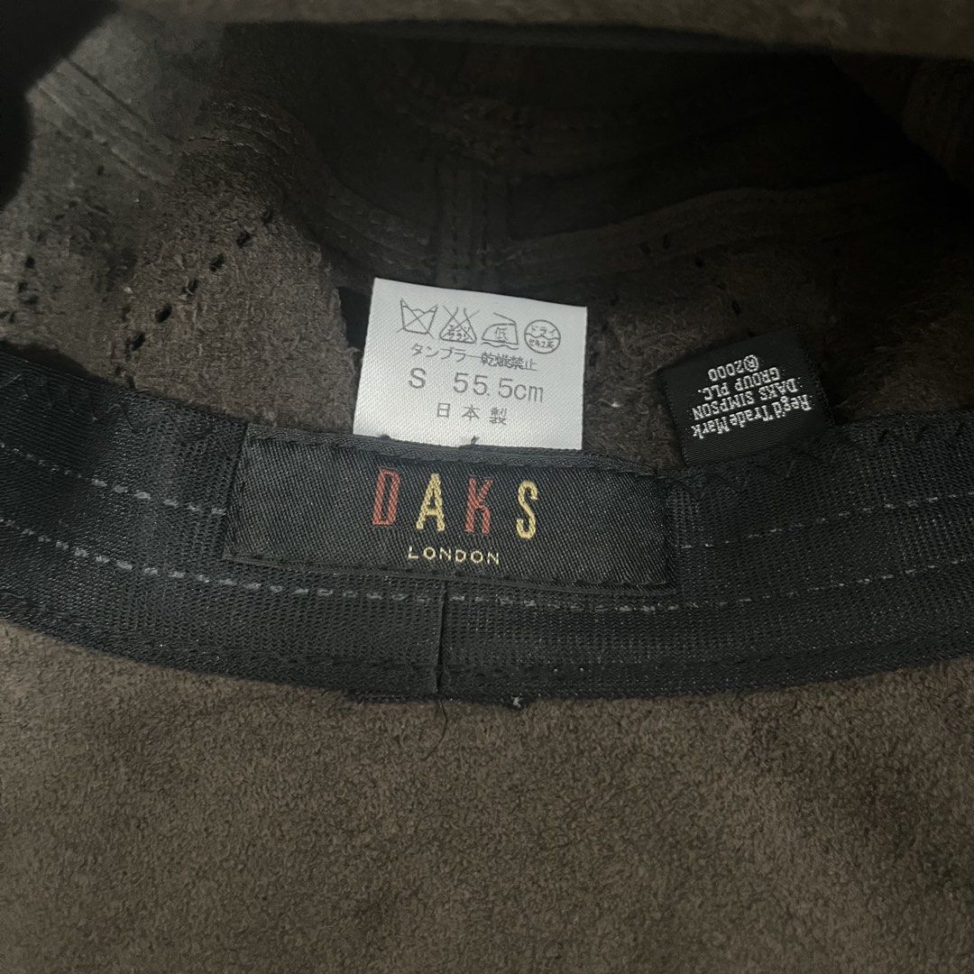 DAKS London Suede Bucket Hat (Category: Caps & Hats) located in Valenzuela. Submitted by any_thingthings (Listing ID 1451410703, Image 3). Description: - Size Small (55.5 cm) - features a decorative quilted diamond stitching and a metallic branding plate on the side.