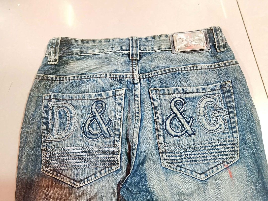 D&G Dolce & Gabbana Distressed Denim Jeans (Category: Jeans) located in Ozamiz City. Submitted by dg0816 (Listing ID 1451339478, Image 3). Description: - Authentic D&G Dolce & Gabbana jeans - Classic blue denim with distressed wash - Features iconic DG logo on front and back pockets - Button and zip closure - Ideal for a casual look.