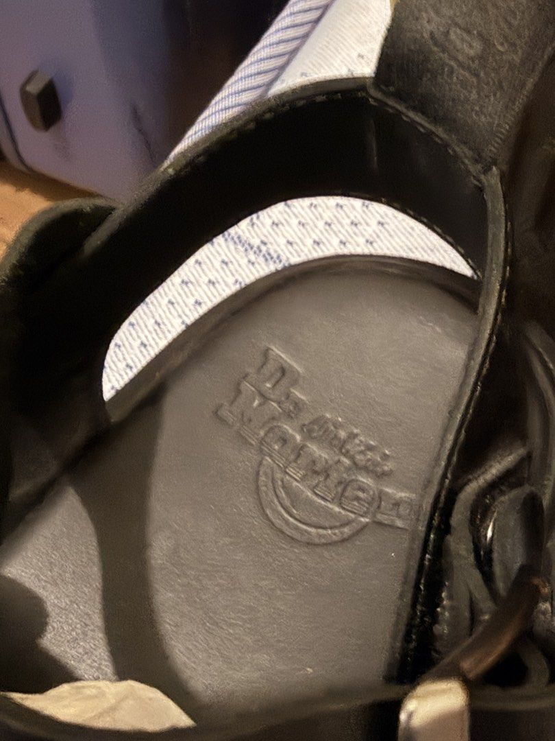 Dr. Martens Black Leather Buckle Strap Sandals (Category: Sneakers & Footwear) located in Manila. Submitted by i-sell-stuff (Listing ID 1451434290, Image 3). Description: - Genuine black leather Dr. Martens sandals - Two adjustable buckle straps across the front - Secure ankle strap with buckle closure - Iconic Dr. Martens sole with air cushioning for comfort - Perfect for everyday wear - Please check photos for detailed condition.