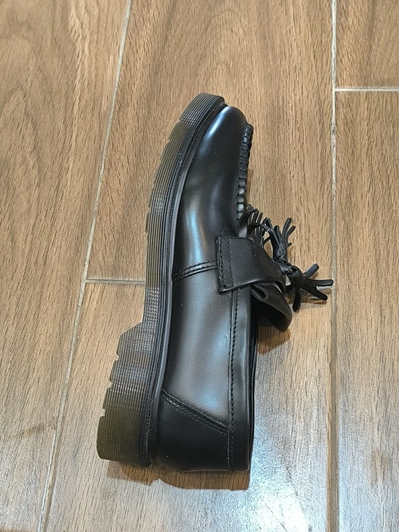Dr. Martens Black Leather Tassel Loafers (Category: Loafers) located in Manila. Submitted by tippytottie (Listing ID 1451420524, Image 3). Description: - Classic black leather Dr. Martens loafers - Features a stylish tassel detail across the vamp - Iconic Dr. Martens air-cushioned sole for comfort and durability - Versatile for dressing up or down, perfect for everyday wear.