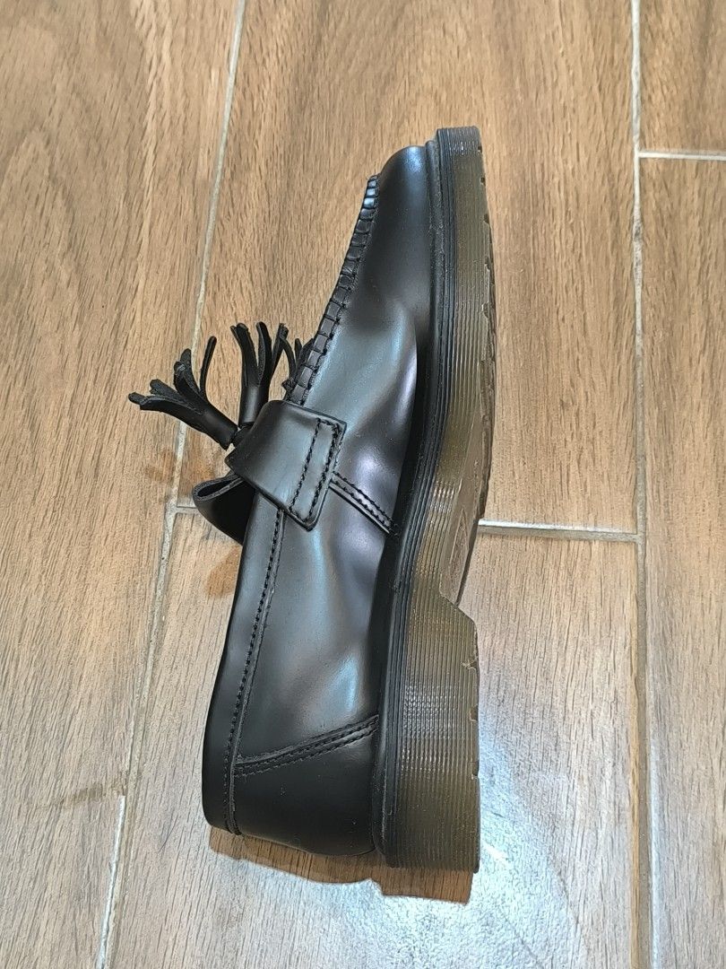 Dr. Martens Black Leather Tassel Loafers (Category: Loafers) located in Manila. Submitted by tippytottie (Listing ID 1451420524, Image 2). Description: - Classic black leather Dr. Martens loafers - Features a stylish tassel detail across the vamp - Iconic Dr. Martens air-cushioned sole for comfort and durability - Versatile for dressing up or down, perfect for everyday wear.