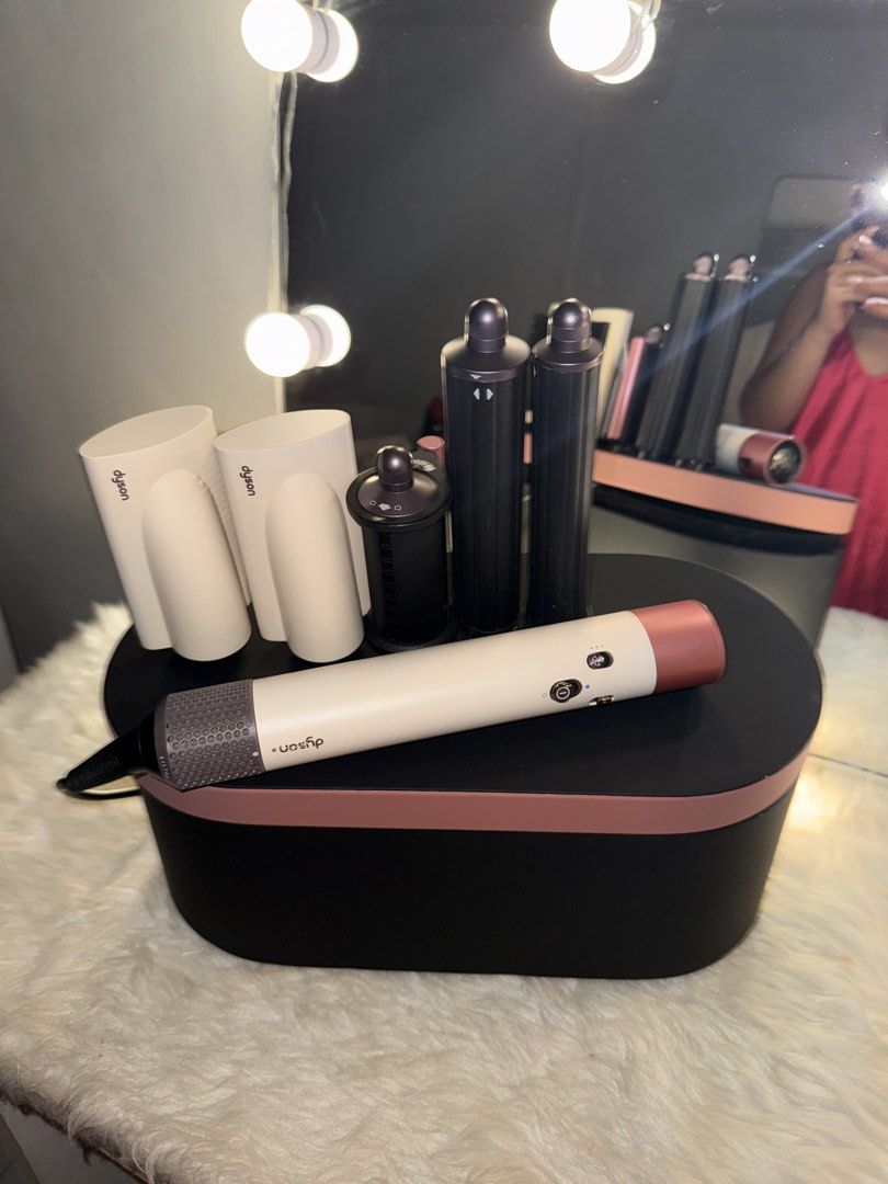 Dyson Airwrap Complete Long (Category: Hair) located in Paranaque City. Submitted by svrmjr (Listing ID 1451515960, Image 2). Description: - Dyson Airwrap Complete long in rose gold color - Includes main styler, barrels, and brushes - All pieces stored neatly in the case - Ideal for achieving salon-quality hairstyles at home - Ready for its new owner used po but just a few scratches and paint chips Honest issue: I lost the round brush and medyo h