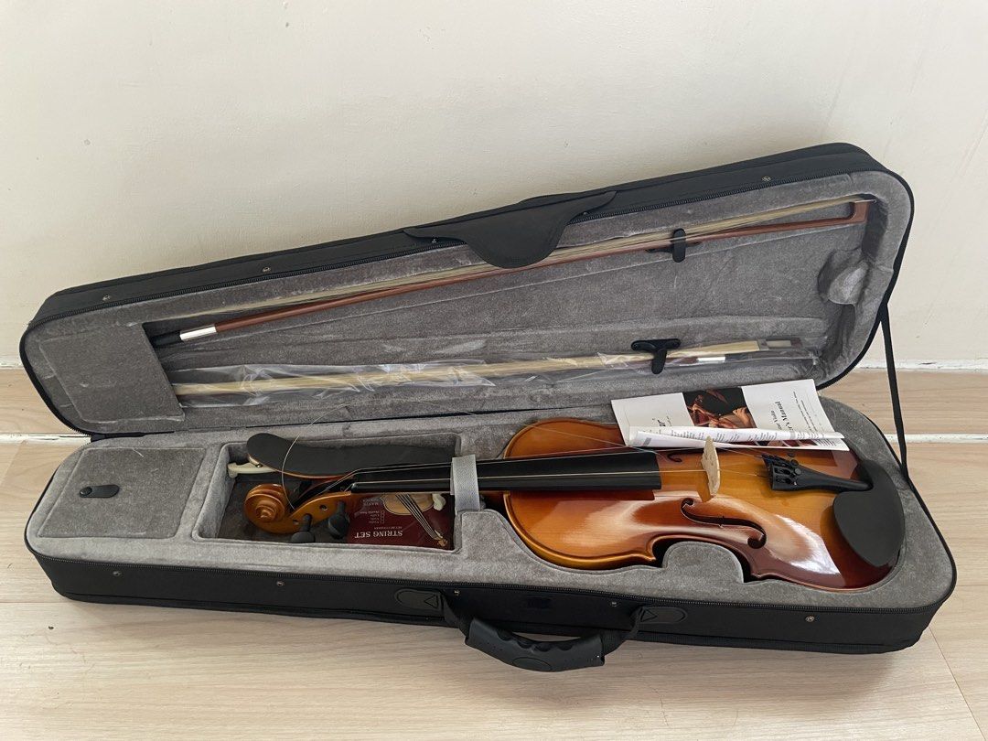Eastar Violin with Case, Bow, Shoulder Rest, and String Set (Category: Musical Instruments) located in Plaridel. Submitted by collectorscamp (Listing ID 1451363141, Image 1). Description: - Eastar Violin - Perfect for beginners! - Complete Set: Includes violin, case, bow, and shoulder rest. - Bonus Accessories: Comes with a new string set and owner's manual. - Ready to Play: All essential items included to start your musical journey..