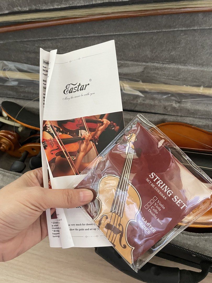 Eastar Violin with Case, Bow, Shoulder Rest, and String Set (Category: Musical Instruments) located in Plaridel. Submitted by collectorscamp (Listing ID 1451363141, Image 3). Description: - Eastar Violin - Perfect for beginners! - Complete Set: Includes violin, case, bow, and shoulder rest. - Bonus Accessories: Comes with a new string set and owner's manual. - Ready to Play: All essential items included to start your musical journey..