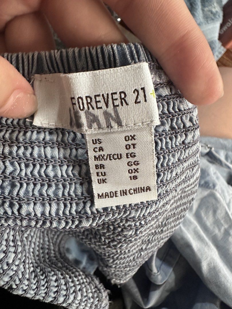 Forever 21 Denim Smocked Crop Top (Category: Others Tops) located in Davao. Submitted by fashiondeclutter11 (Listing ID 1451394599, Image 2). Description: - Cute light wash denim crop top - Smocked bodice for a comfy fit - Adjustable straps - Cropped length with a handkerchief hem - Ideal for casual outings or layering.