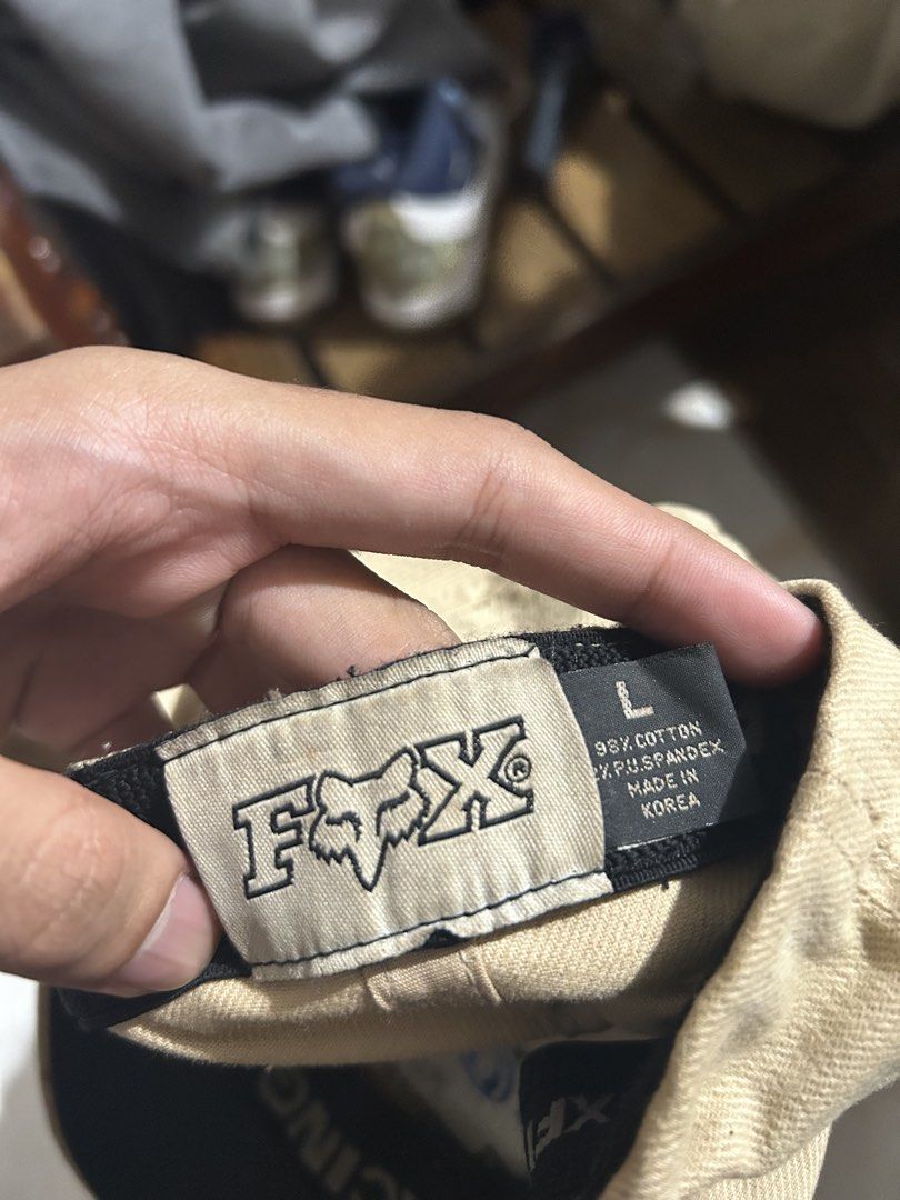 Fox Racing Inc. Flexfit Cap Size L (Category: Caps & Hats) located in Manila. Submitted by romnick907 (Listing ID 1451517586, Image 3). Description: - Tan Fox Racing Flexfit Cap - Size: Large (L) - Material: Cotton and Spandex blend - Origin: Made in Korea - Condition: Minor dirt marks on the brim - Perfect for casual wear or sports activities.
