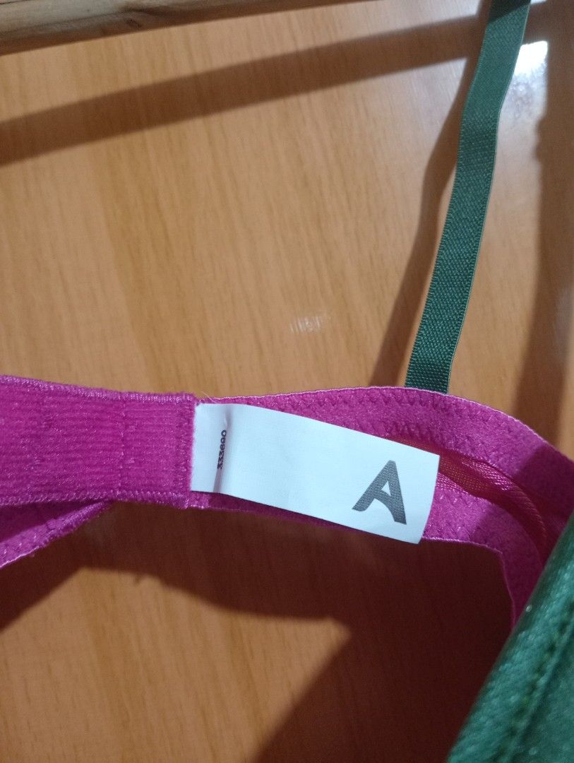 Green and Pink Bra with A Cup Size (Category: Undergarments & Loungewear) located in Quezon City. Submitted by niceoutfits (Listing ID 1451502541, Image 3). Description: - Two bras available: 1 green & pink with small bow (tag 'A'), 1 plain beige. - LP POSTED - SIZE : 32 A - Both bras feature adjustable straps. - Both bras have a secure hook and eye closure..