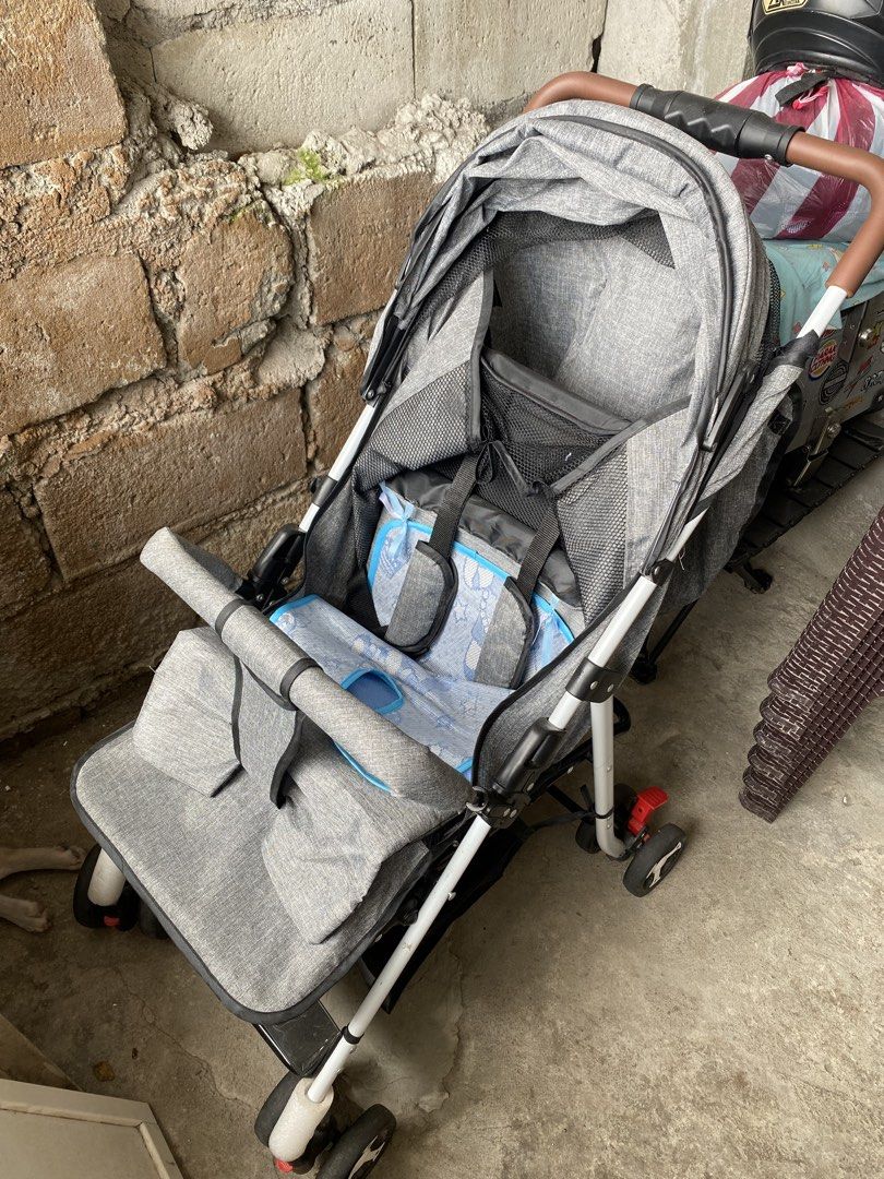 Grey Baby Stroller with Canopy and Storage Basket (Category: Strollers) located in Manila. Submitted by taladrift (Listing ID 1451367723, Image 1). Description: - Grey baby stroller - Sun protection canopy - Convenient storage basket underneath - Padded seat insert for comfort - Easy to maneuver with swivel wheels - Folds for convenient storage - Ideal for outings with your baby.