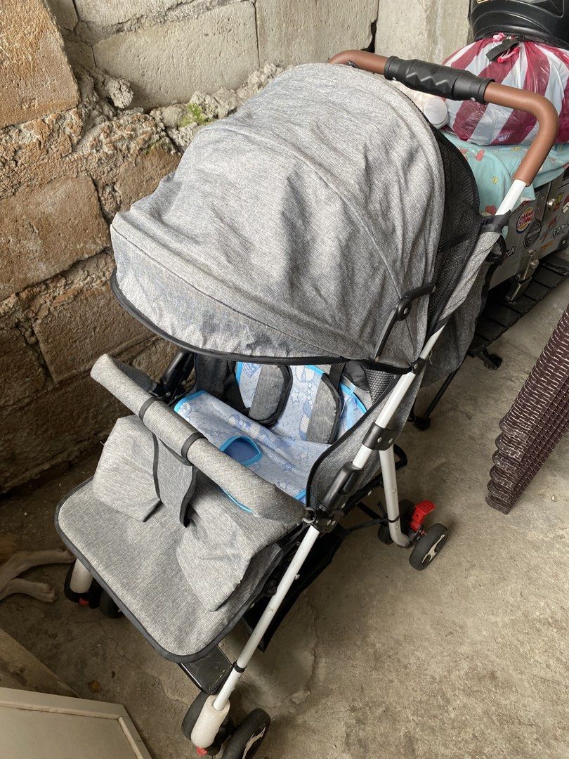 Grey Baby Stroller with Canopy and Storage Basket (Category: Strollers) located in Manila. Submitted by taladrift (Listing ID 1451367723, Image 2). Description: - Grey baby stroller - Sun protection canopy - Convenient storage basket underneath - Padded seat insert for comfort - Easy to maneuver with swivel wheels - Folds for convenient storage - Ideal for outings with your baby.