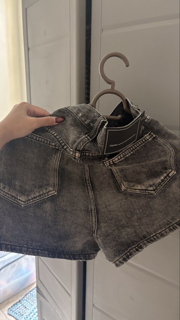Grey Denim Shorts (Category: Shorts) located in Manila. Submitted by declutterbybeans (Listing ID 1451363015, Image 2). Description: - Grey denim shorts - Button and zip closure - Front and back pockets - Slightly faded wash - Estimated size: Small - Ideal for casual outfits.