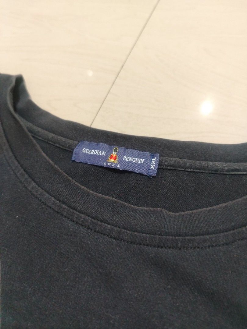 Guardian Penguin T-Shirt (Category: Tshirts & Polo Shirts ) located in Tanza. Submitted by reddererd (Listing ID 1451364071, Image 2). Description: Width: 22 Length: 29 Color Rate: 7.5 Condition: 8.5 Issues: slight fade, unnoticeable discoloration on the neck 📌This item is thrifted and/or personally used, so please manage your expectations Mode of Payment: G Cash Mode of Delivery: J&T.