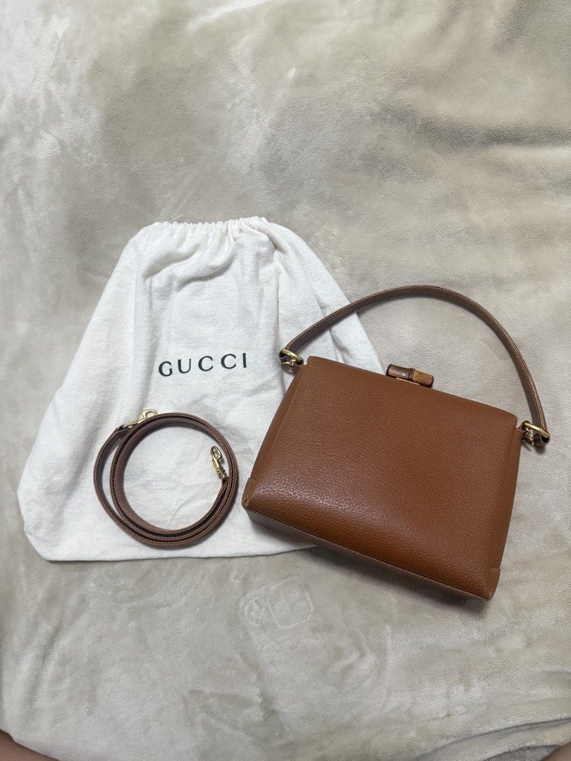 Gucci Bamboo Top Handle Bag Brown Leather (Category: Luxury Bags & Wallets) located in Muntinlupa City. Submitted by marthapee (Listing ID 1451427573, Image 2). Description: - Authentic brown leather Gucci handbag - Iconic bamboo closure - Detachable shoulder strap included - Original dust bag included - Versatile for day or night use - A timeless addition to your collection.