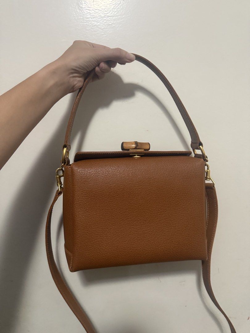 Gucci Bamboo Top Handle Bag Brown Leather (Category: Luxury Bags & Wallets) located in Muntinlupa City. Submitted by marthapee (Listing ID 1451427573, Image 1). Description: - Authentic brown leather Gucci handbag - Iconic bamboo closure - Detachable shoulder strap included - Original dust bag included - Versatile for day or night use - A timeless addition to your collection.