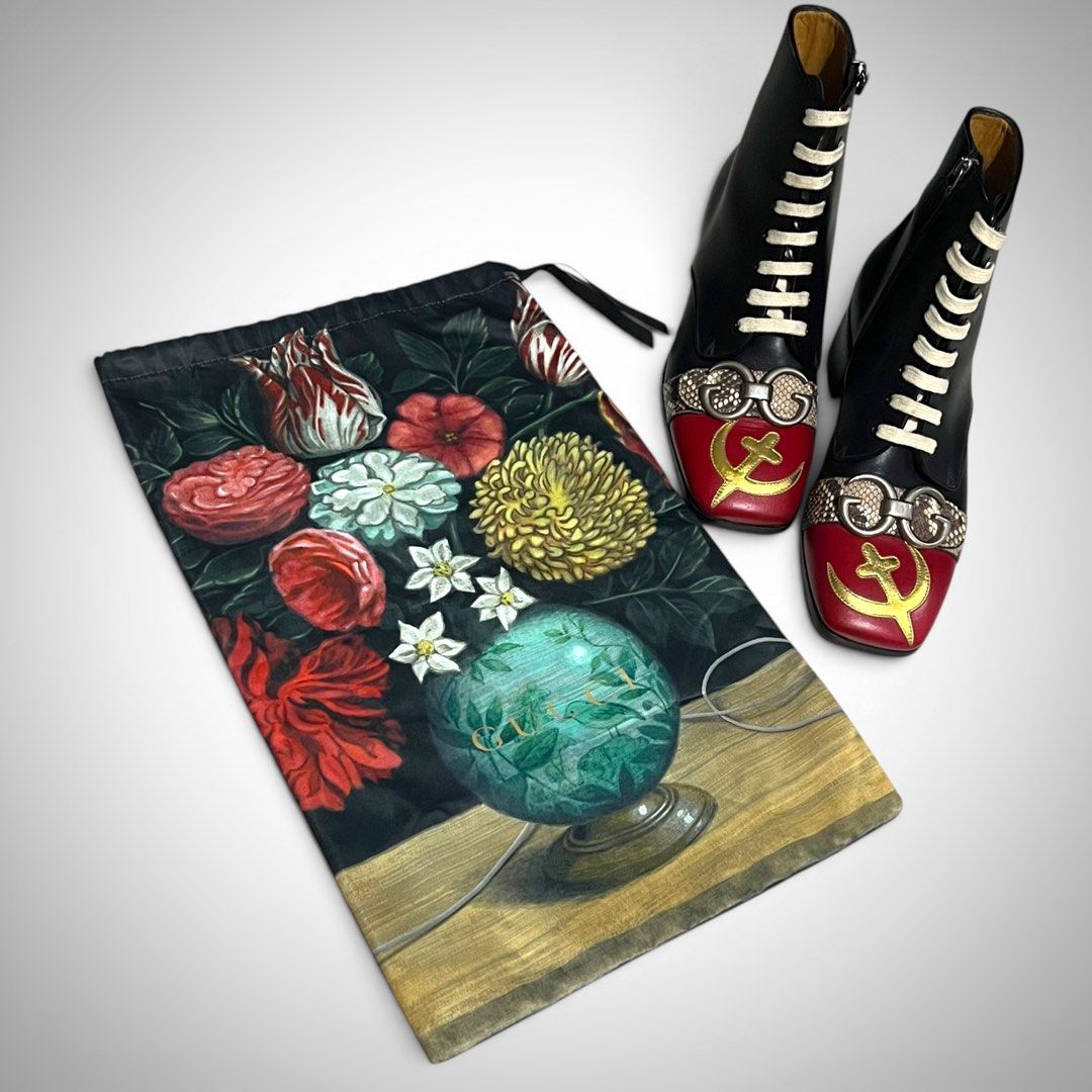 Gucci FW17 Pierced Moon USSR Communist Boots (Category: Boots) located in Cavite. Submitted by desirepaths9 (Listing ID 1398682453, Image 3). Description: Released in 2017, during a period when fashion heavily borrowed from Eastern European aesthetics, Gucci introduced boots that resembles the hammer and sickle motif. This presented a striking contradiction, as a high-end luxury brand reworked a symbol traditionally associated with anti-capitalis