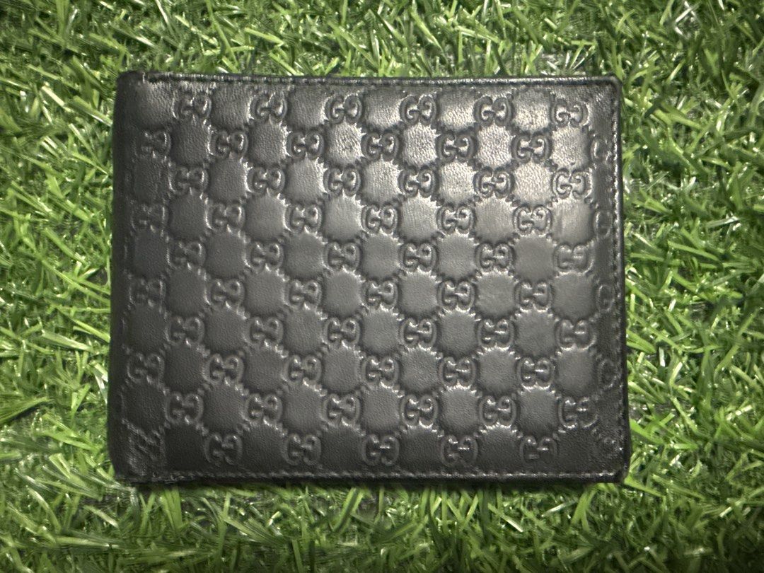 Gucci Monogram Bi-fold Wallet Black Leather (Category: Luxury Bags & Wallets) located in Marilao. Submitted by its_me_bolinoy (Listing ID 1451331550, Image 1). Description: - Genuine black leather Gucci wallet - Features iconic embossed GG monogram - Classic bi-fold design - Multiple card slots for organization - Includes a clear ID window - Stylish and practical for everyday carry.