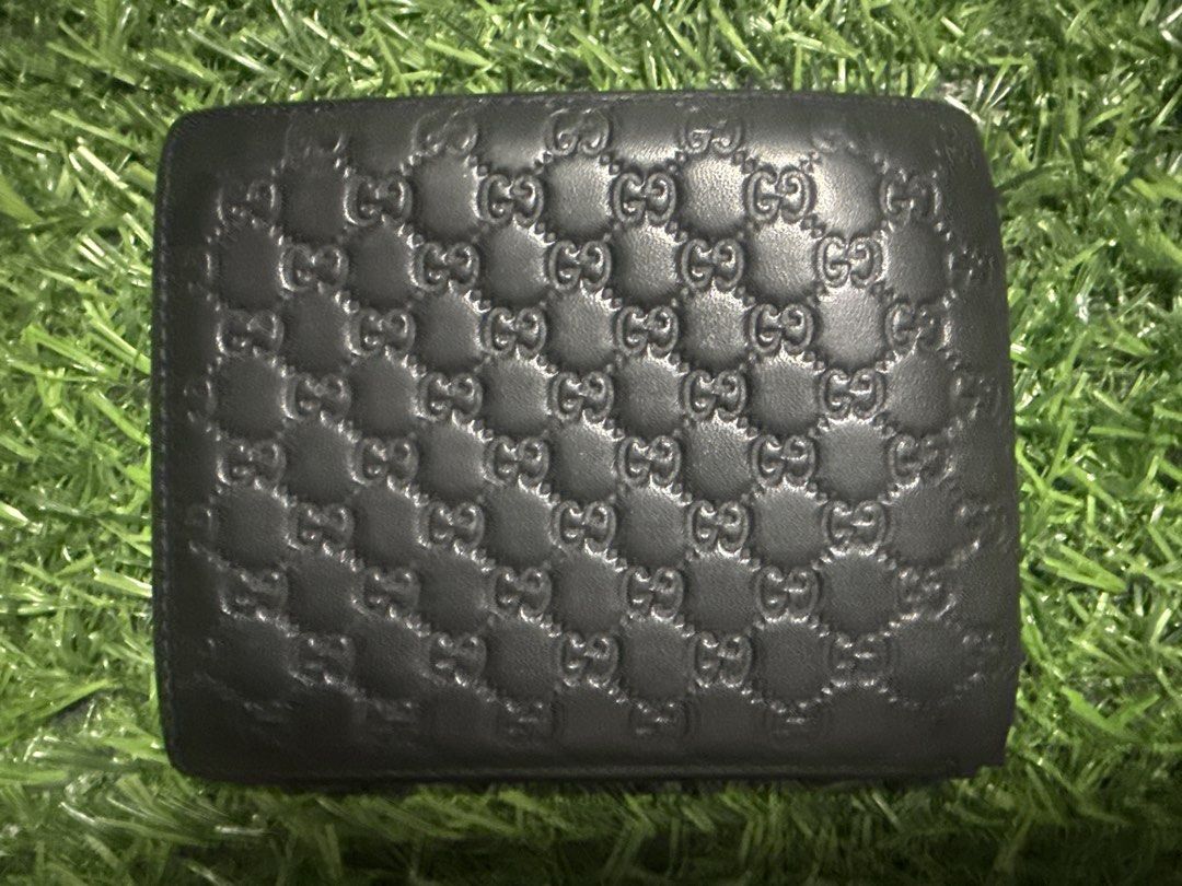 Gucci Monogram Bi-fold Wallet Black Leather (Category: Luxury Bags & Wallets) located in Marilao. Submitted by its_me_bolinoy (Listing ID 1451331550, Image 2). Description: - Genuine black leather Gucci wallet - Features iconic embossed GG monogram - Classic bi-fold design - Multiple card slots for organization - Includes a clear ID window - Stylish and practical for everyday carry.