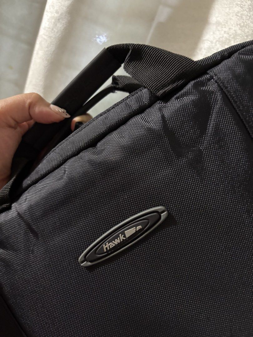 Hawk Laptop Bag - Black, Durashield Fabric (Category: Backpacks) located in Mandaluyong City. Submitted by mclldmrl (Listing ID 1451337244, Image 2). Description: - Brand: Hawk - Material: Durashield fabric for enhanced durability - Compartments: Main compartment and front pockets for organized storage - Carrying Options: Comfortable top handles and a detachable shoulder strap - Ideal for: Work, travel, and carrying essentials -3 PCS AVAIL.