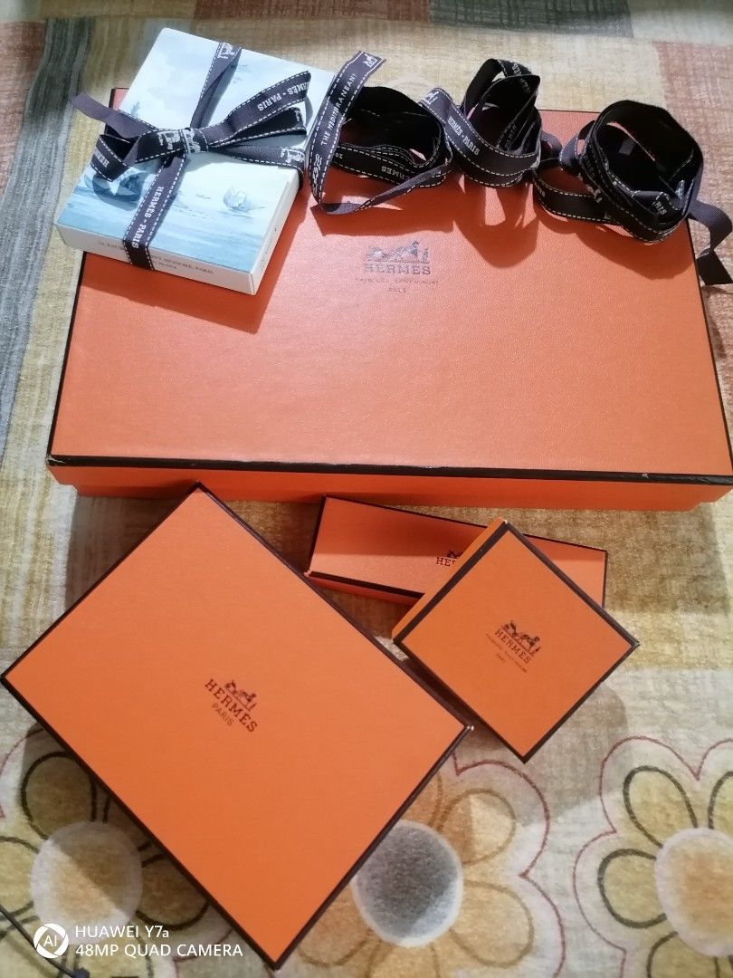 Hermes Gift Boxes and Shopping Bags (Category: Luxury Bags & Wallets) located in Naga. Submitted by mrwisethrifter (Listing ID 1451373251, Image 3). Description: - Authentic Hermes orange gift boxes and shopping bags bundle - Includes various sizes of boxes - Three paper shopping bags included - Some boxes come with original ribbons - Ideal for gifting or storing small luxury items.