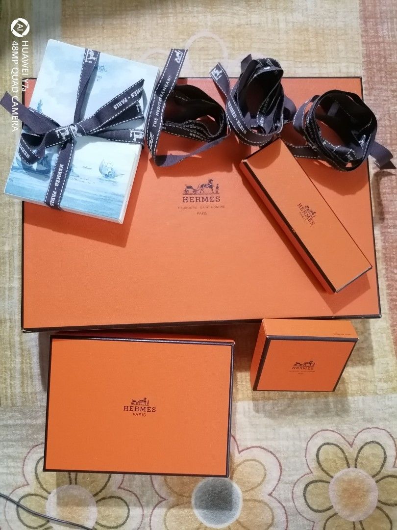 Hermes Gift Boxes and Shopping Bags (Category: Luxury Bags & Wallets) located in Naga. Submitted by mrwisethrifter (Listing ID 1451373251, Image 1). Description: - Authentic Hermes orange gift boxes and shopping bags bundle - Includes various sizes of boxes - Three paper shopping bags included - Some boxes come with original ribbons - Ideal for gifting or storing small luxury items.