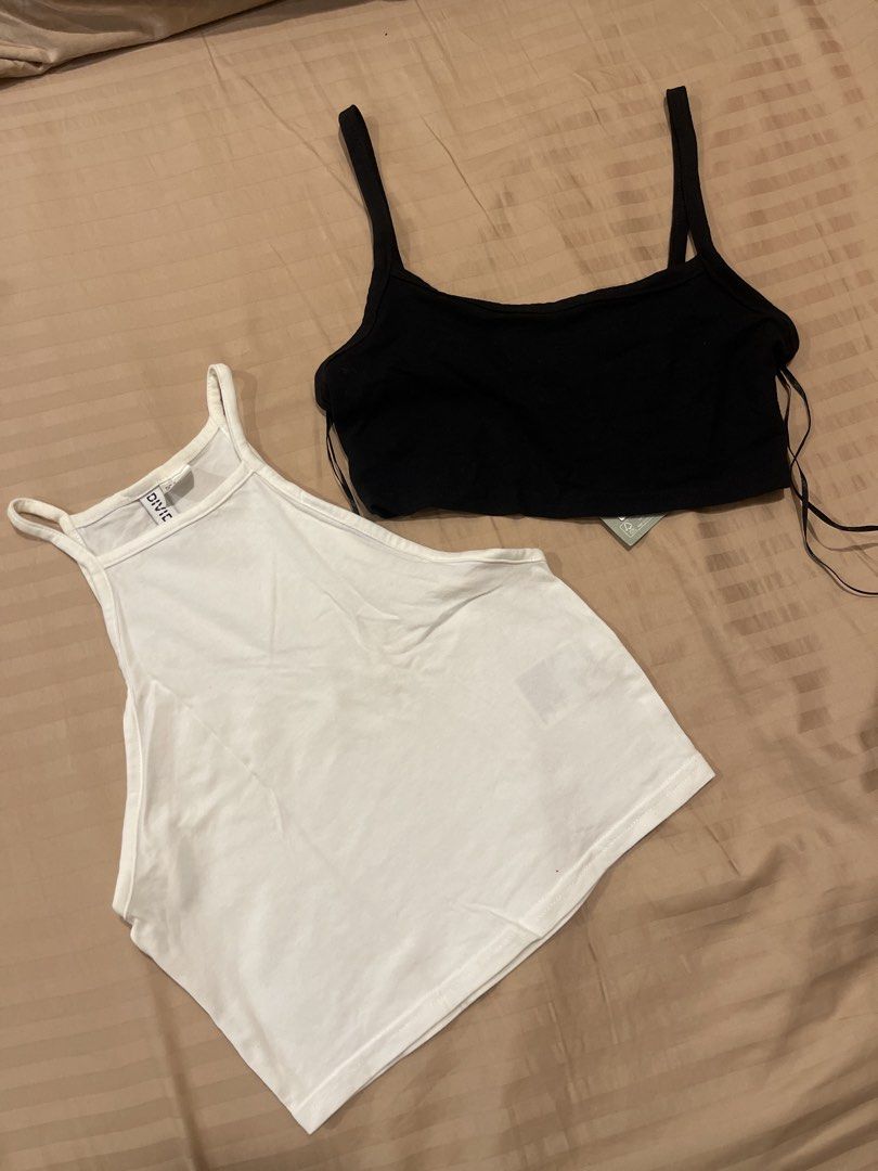 H&M Divided Basic Crop Tops (White & Black) (Category: Shirts) located in Marikina City. Submitted by bimbems (Listing ID 1451446971, Image 1). Description: - Two H&M Divided basic crop tops - White top: Size S (worn once) - Black top: Size XXS (brand new) - Material: Ribbed fabric - Design: Spaghetti straps - Versatile: Perfect for layering or wearing solo - Black top includes original tags RFS: decluttering Loc 📍: Marikina City Jnt Delivery.