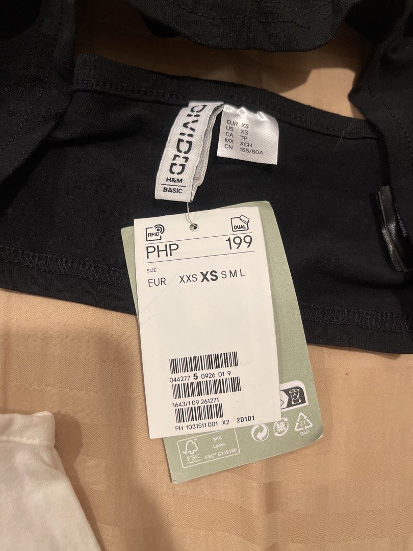 H&M Divided Basic Crop Tops (White & Black) (Category: Shirts) located in Marikina City. Submitted by bimbems (Listing ID 1451446971, Image 3). Description: - Two H&M Divided basic crop tops - White top: Size S (worn once) - Black top: Size XXS (brand new) - Material: Ribbed fabric - Design: Spaghetti straps - Versatile: Perfect for layering or wearing solo - Black top includes original tags RFS: decluttering Loc 📍: Marikina City Jnt Delivery.