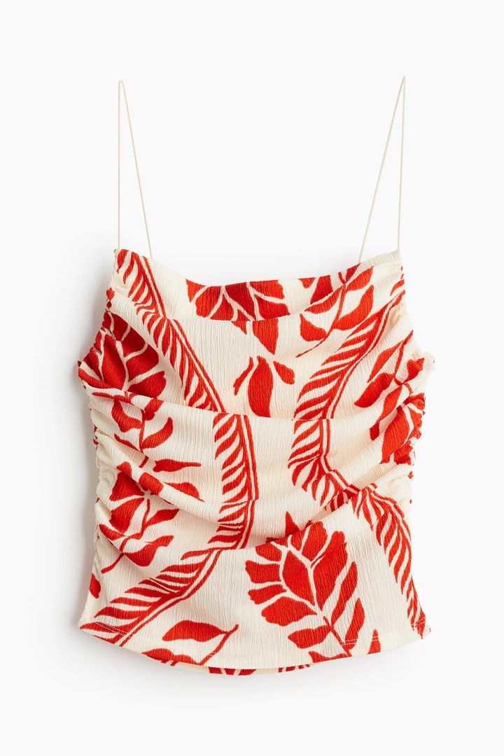 H&M Red Floral Print Ruched coords (Category: Sets & Coordinates) located in Pasuquin. Submitted by licashop.ph (Listing ID 1451369236, Image 2). Description: - H&M cream and red floral print coords - Features spaghetti straps and a square neckline - Ruched detailing on the bodice for a flattering fit - Side slit for ease of movement - Ideal for vacations or summer parties - Made from a light and breezy fabric.