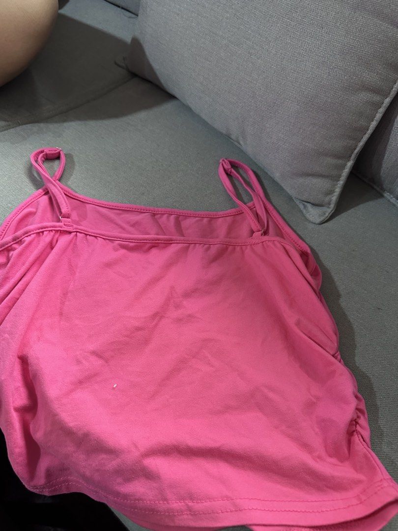 Hot Pink Ruched Cami Tank Top (Category: Sleeveless) located in Davao. Submitted by fashiondeclutter11 (Listing ID 1451394687, Image 2). Description: - Adorable hot pink cami tank top - Features adjustable straps for a perfect fit - Stylish ruched detail on the back - Made from stretchy, comfortable fabric - Versatile for layering or wearing on its own - Easily pairs with jeans or shorts.