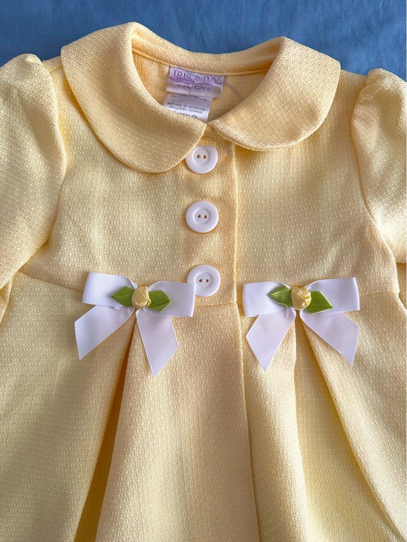 Iris & Ivy Baby Yellow Coat 24M (Category: Babies & Kids Fashion) located in Quezon City. Submitted by crslph (Listing ID 1451386998, Image 2). Description: - Cute vibrant yellow baby coat from Iris & Ivy - Textured fabric - Peter Pan collar - Three white buttons up the front - Adorned with white ribbon bows with little green and yellow flowers - Pleated front detail - Perfect for spring or cooler weather - Worn once only.