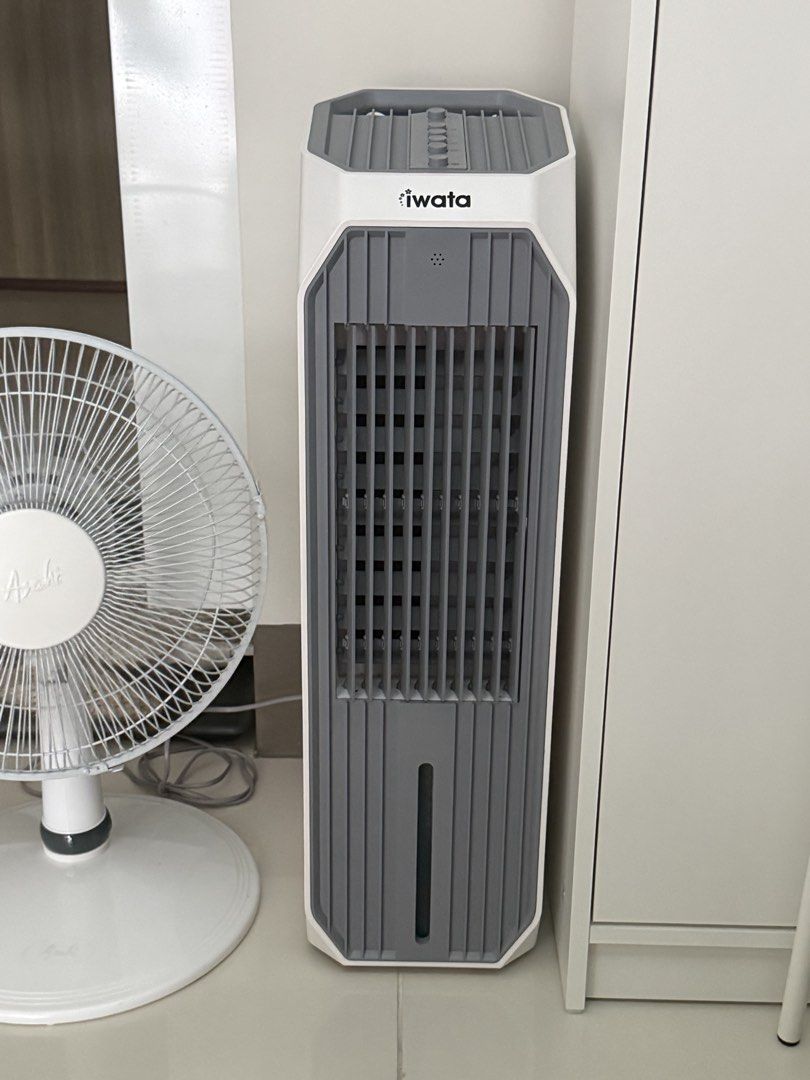 Iwata Air Cooler Tower Fan (Category: Air Conditioning and Heating) located in Manila. Submitted by artyreal (Listing ID 1451389194, Image 1). Description: - original price is 5800 -good as new -Iwata Tower Air Cooler - Tall and slim design - Effectively cools down rooms - Features a front water level indicator - In good working condition - Reason for selling: Upgraded to an air conditioner.