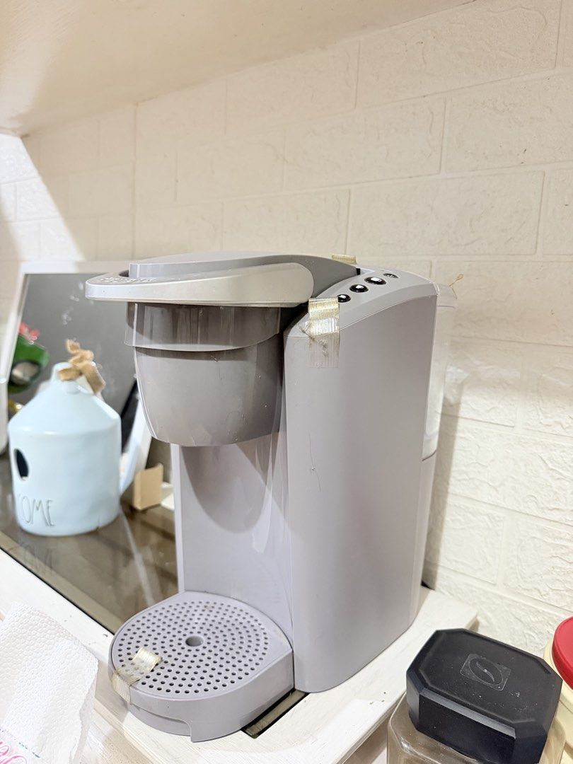 Keurig Grey Single Serve Coffee Maker with Reusable Filter (Category: Coffee Machines & Makers) located in Paranaque City. Submitted by hannahking36 (Listing ID 1451470076, Image 1). Description: 110V from US! No box. Not used. Grey single serve coffee maker. Works well. Comes with FREE reusable filter basket. Easy to use for your morning coffee. Drip tray is removable. Water reservoir is on the side. .