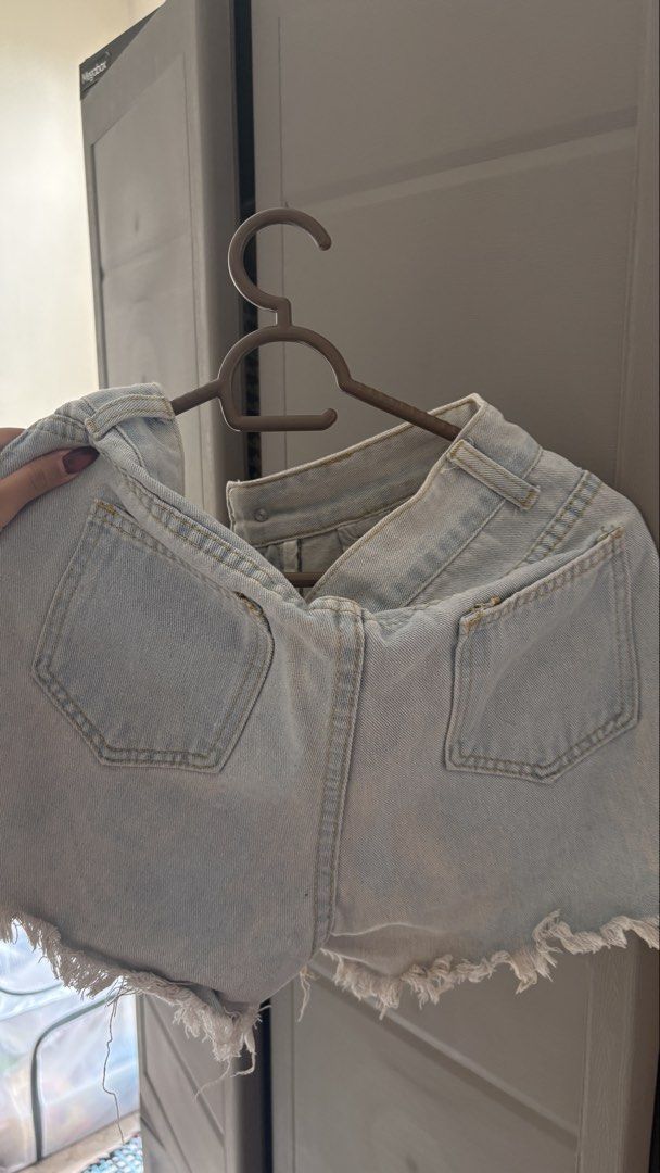 Light Wash Ripped Denim Shorts (Category: Shorts) located in Manila. Submitted by declutterbybeans (Listing ID 1451363009, Image 2). Description: - Light wash denim shorts - High-waisted style - Distressed rips and frayed hem - Zipper and button front closure - Two back pockets - Ideal for casual wear.
