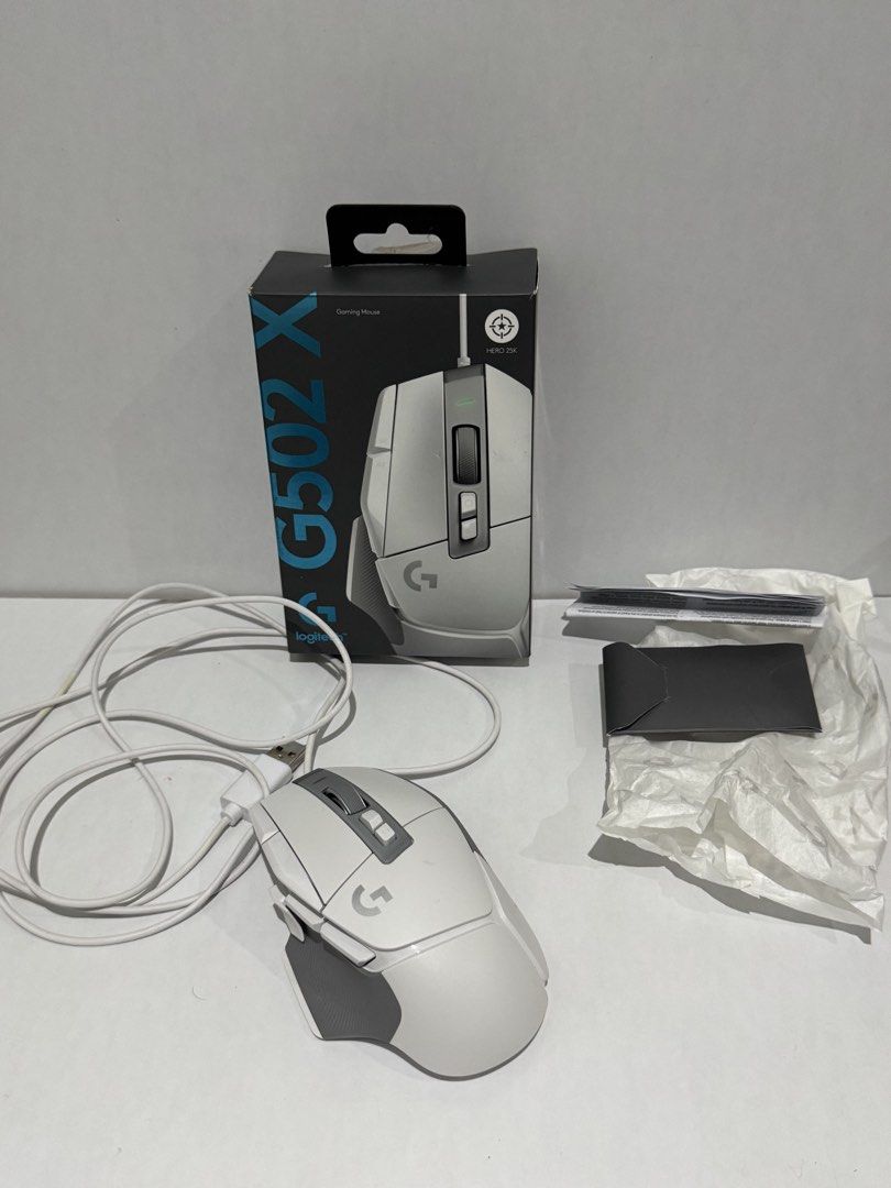 Logitech G502 X (Wired) in White (Category: Mouse & Mousepads) located in Davao. Submitted by ninialsalman (Listing ID 1451387996, Image 1). Description: Selling low Some marks on cord and mouse (see slides 3 and 4) Bought for 5,800+ in Thinking Tools SM Davao Ecoland Complete with box, missing receipt Rfs: decluttering! Di nagagamit .