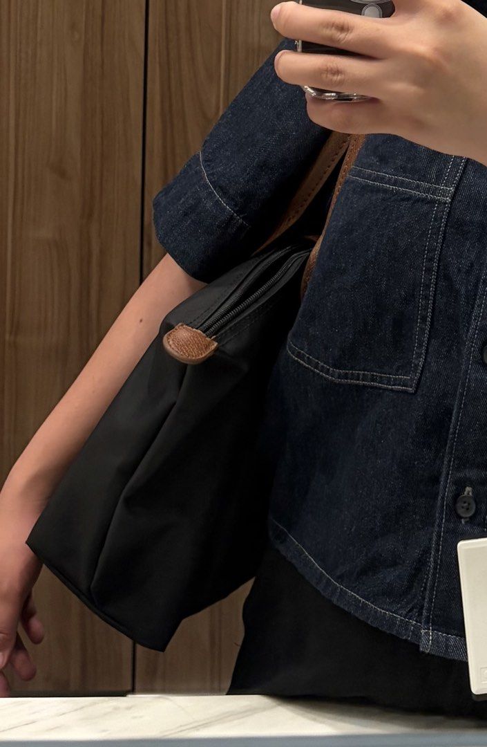 Longchamp | not auth3ntic (Category: Luxury Bags & Wallets) located in Manila. Submitted by hey.mdelo192 (Listing ID 1451394755, Image 1). Description: ₱1,000 (NEGOTIABLE) - size MEDIUM - color BLACK - nylon outside & leather inside - no issue aside from gold hardware is a bit fading (see other photos).